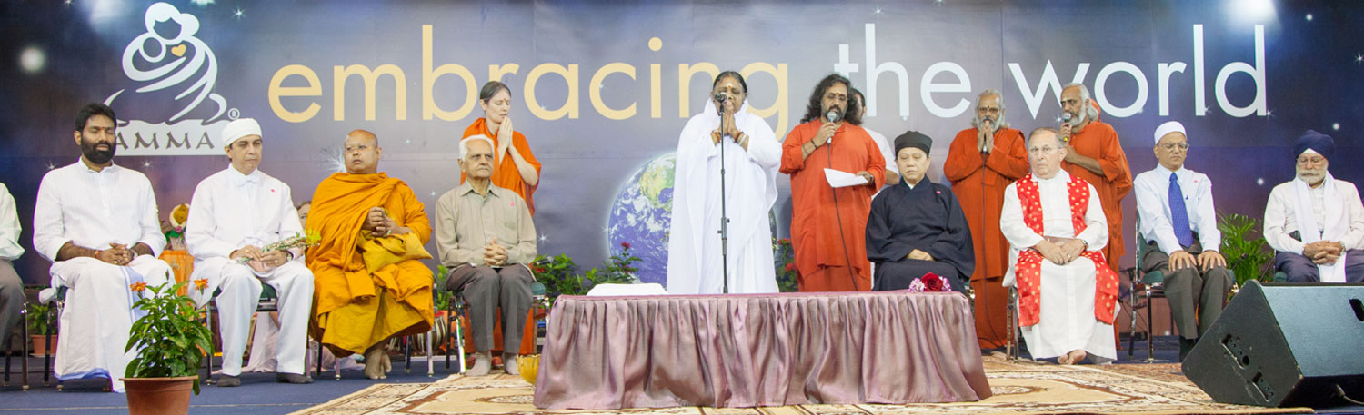 Amma on stage during an Embracing the World function