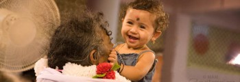Amma holding a child