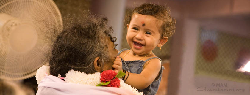 Amma holding a child