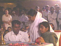 Amma consoling a girl whose mother and brother passed away in Gujarat earthquake