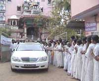 Amma's car driving by the temple