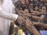 Amma with a group of orphans