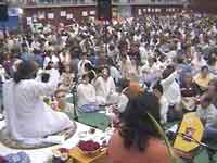 Amma leads the arati during the Atma Puja