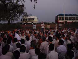 Amma sitting with the tour group