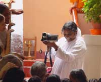 Amma filming the devotees