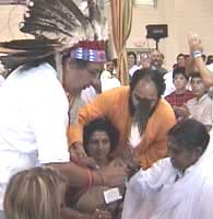 Native American Indian Chief gives eagle feather to Amma