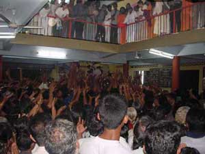 Amma with devotees on balcony