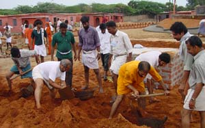 Br. Yogamrita with volunteers at the construction site