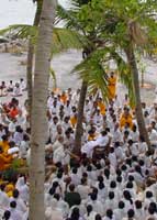 Amma with ashramites by the seashore