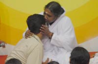 Amma giving darshan to a medical student