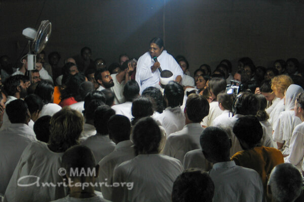 Amma with devotees on the rooftop