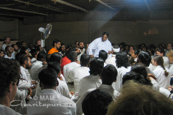 Amma with her devotees on the rooftop