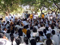 Amma with devotees on the roadside