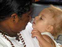 Amma holding a child