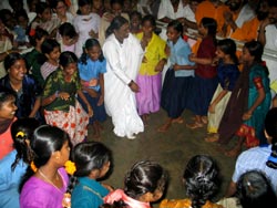 Amma dancing with children