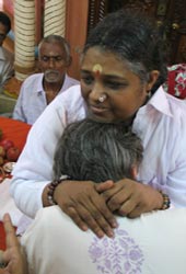 Amma wearing a devotee's shirt