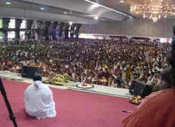 Amma sitting on stage on Onam