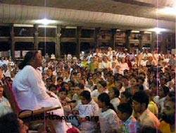 Amma in the ashram hall on New Year's Eve 2004