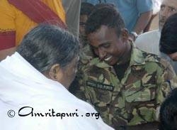 Amma giving darshan to a Sri Lankan  soldier