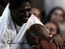 Amma gives darshan to a Buddhist monk