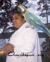 Amma with a parrot on her shoulder