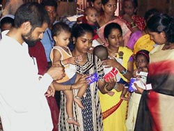 Dr chandra sekhar giving medicines to the mothers