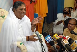 Amma talking to journalists in Amritapuri