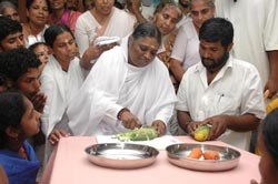 Amma preparing vegetables in the kitchen