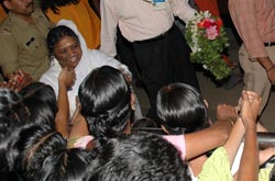 Amma with devotees at the airport