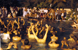 Amma swimming with the devotees