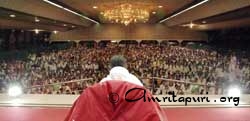 Amma speaking to the devotees in Amritapuri