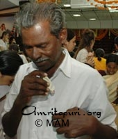 A devotee from Kozhikode after receiving Amma's darshan