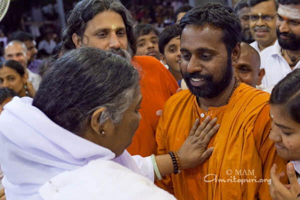 Amma giving darshan to a man
