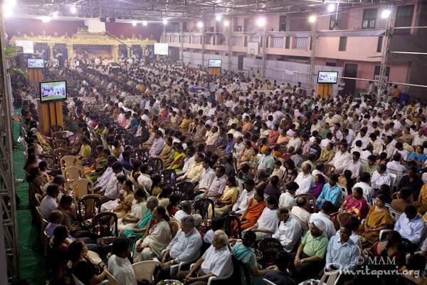 Devotees participating in puja