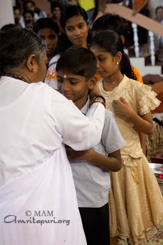 Amma giving away Vidyamritam scholarships