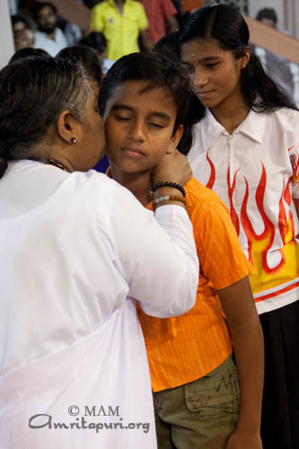 Amma giving away Vidyamritam scholarships