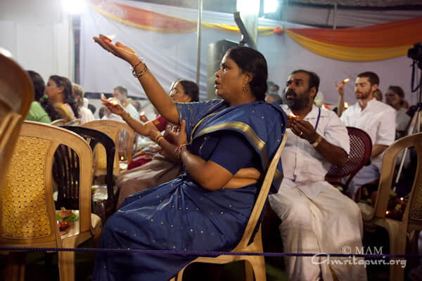 A devotee participating in the puja