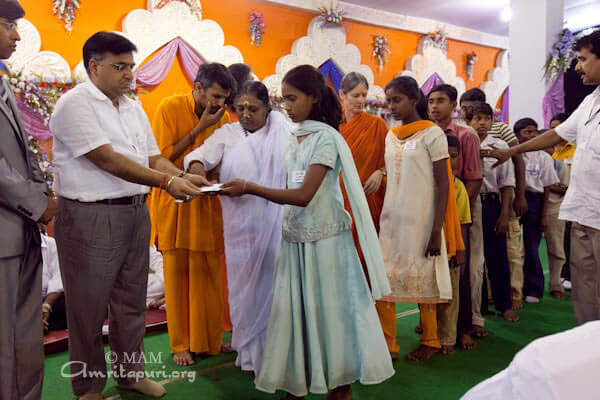 Amma giving away Vidyamritam scholarships to 50 students