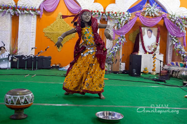 Two in One: Jinitha, a girl with a mask of a man on the back side.