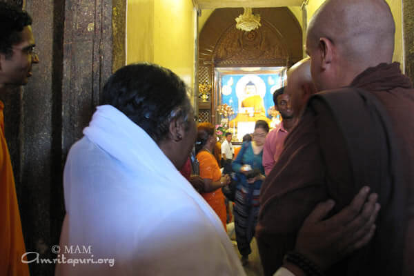 Amma at the temple of Buddha