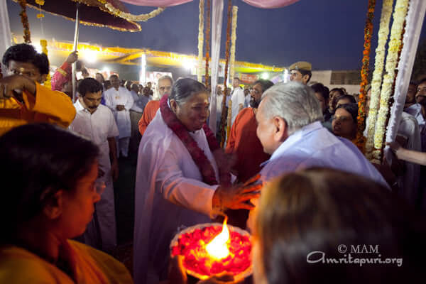 Welcoming amma with Padapuja and arati