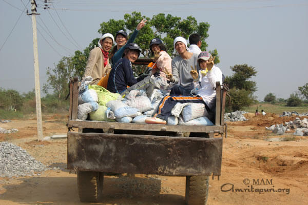 Students riding a tractor