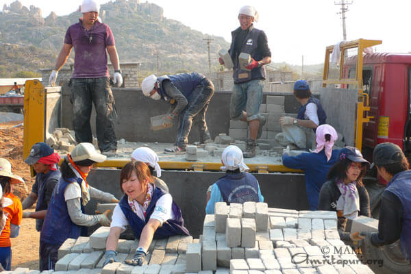 Students unloading stone blocks