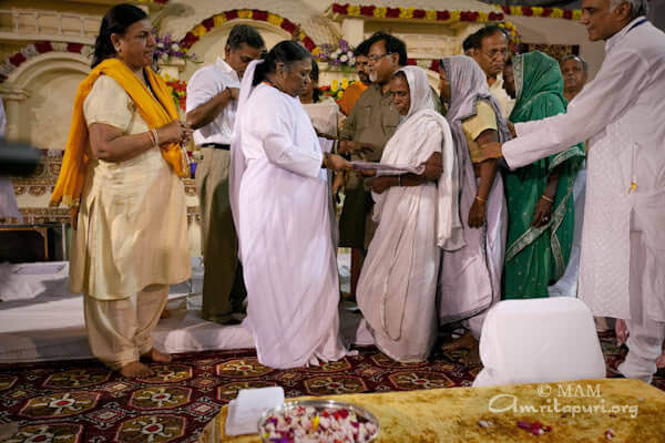 Amma giving Amrita Nidhi - free monthly pension