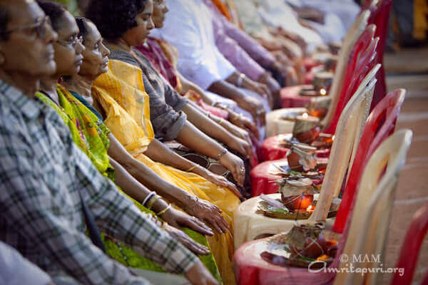 People participating in puja