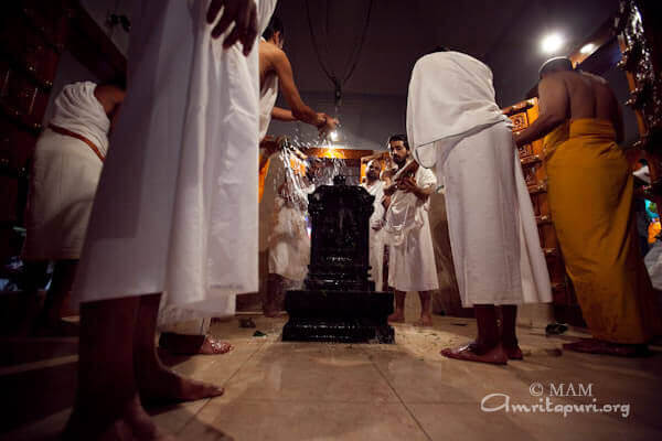 People participating in Sani puja, walking towards the temple