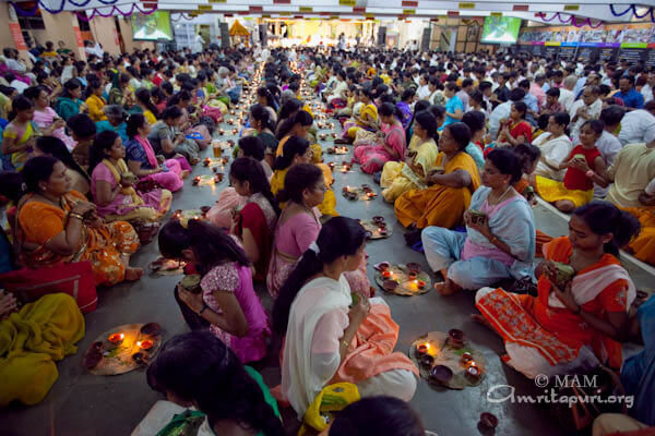 Devotees participating in puja