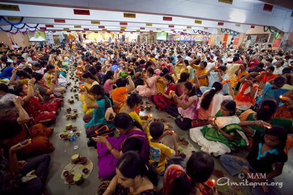 Devotees participating in puja