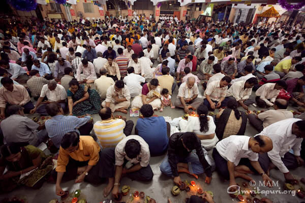 Devotees participating in puja