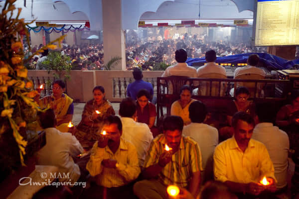Devotees participating in puja